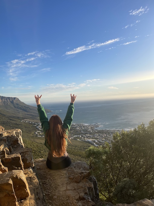 Hannah at Kloof Corner with her hands up