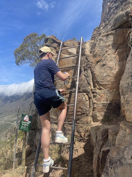 Liam climbing a ladder on Lion's Head 