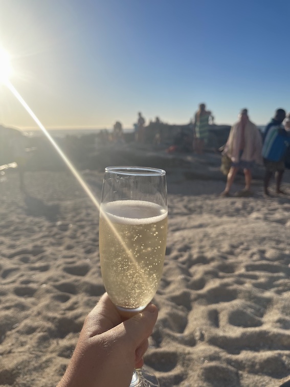 A glass of MCC on Saunders Rocks Beach