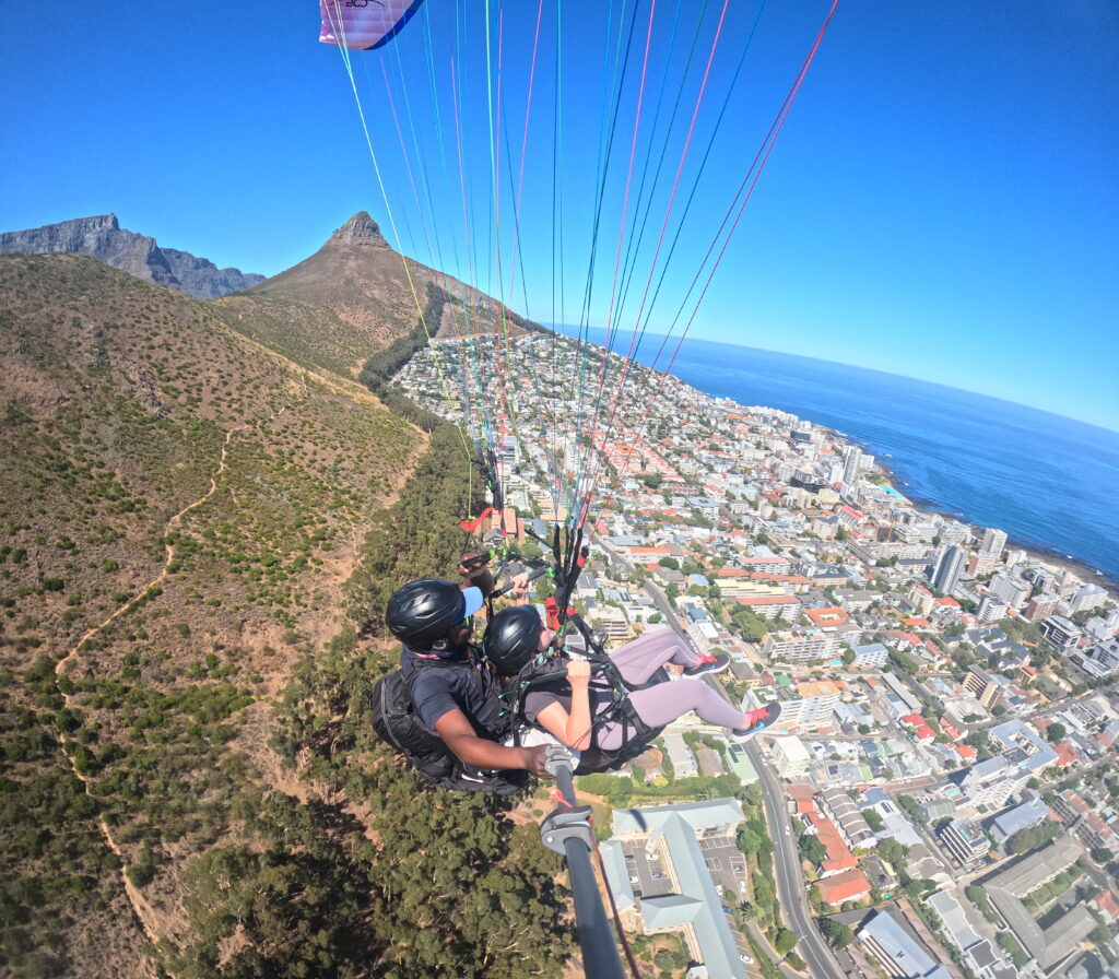 Hannah paragliding over Sea Point in Cape Town