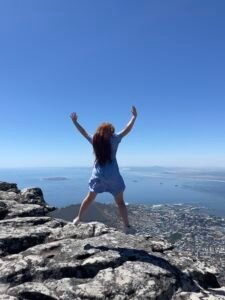 Hannah jumping on Table Mountain