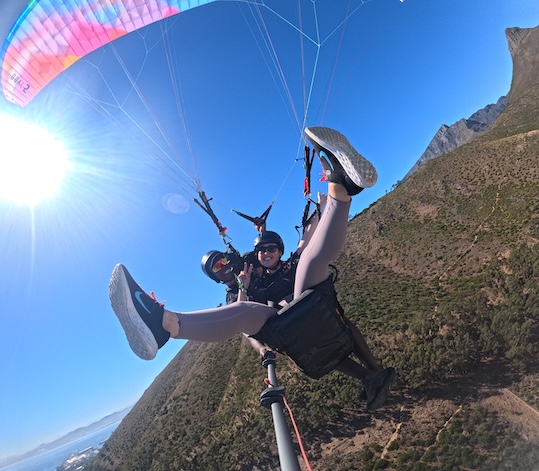 Hannah paragliding over Sea Point in Cape Town