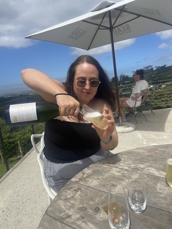 Stacey pouring wine at Beau Constantia