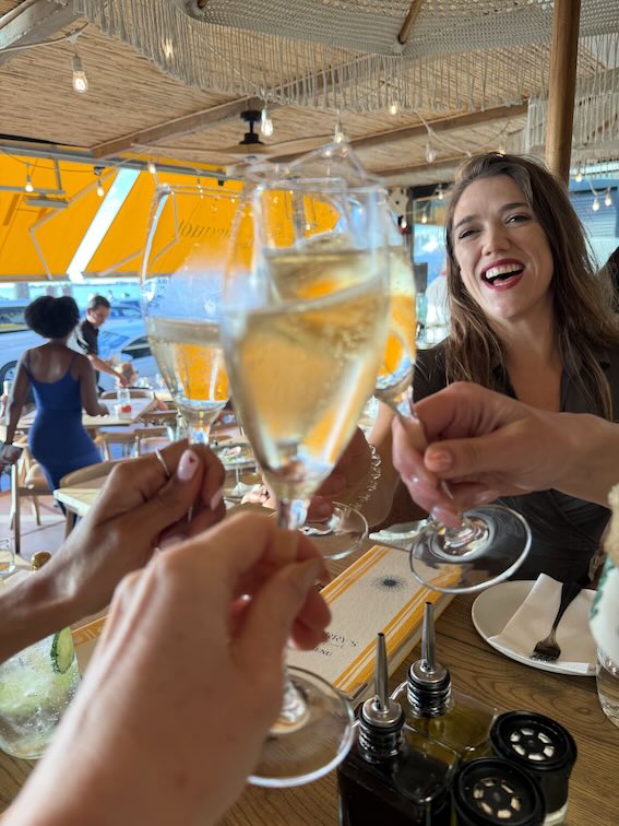 Sarah cheersing at Harry's