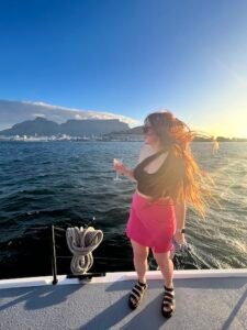 Hannah standing on the sunset champagne cruise