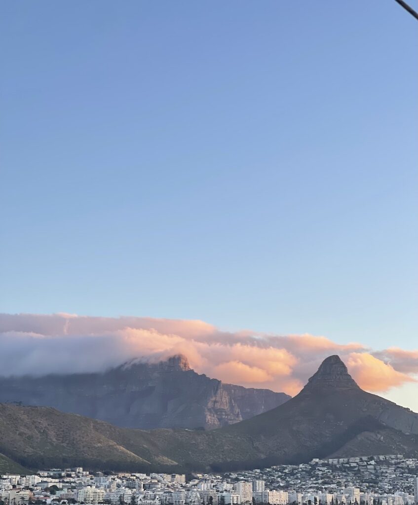 Lion's Head and Table Mountain with clouds at sunset from the boat cruise