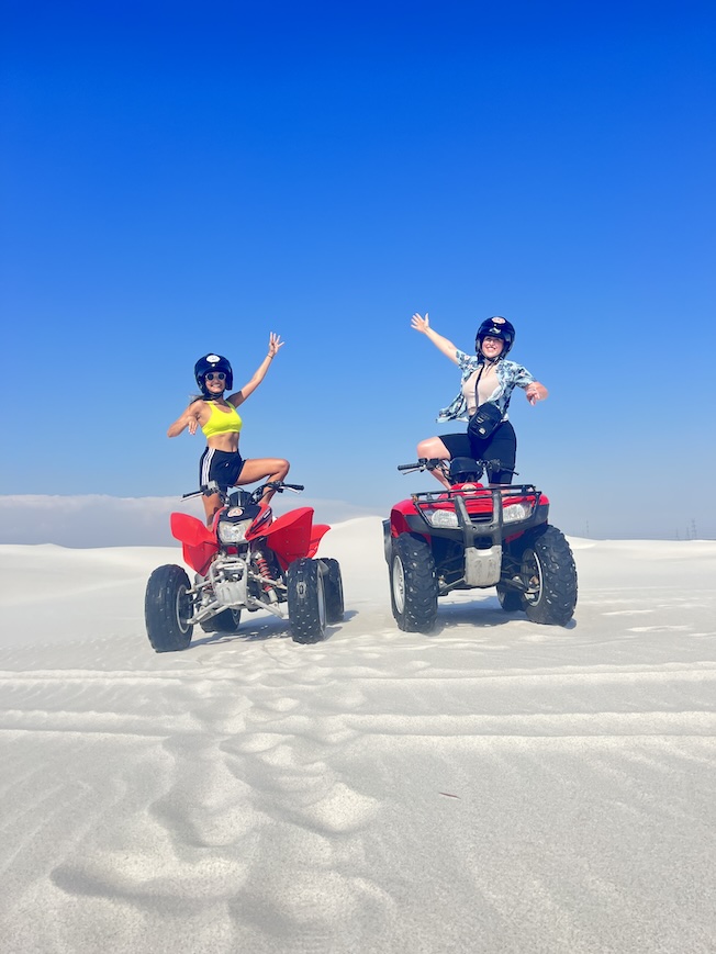 Hannah and Sophie posing on an ATV