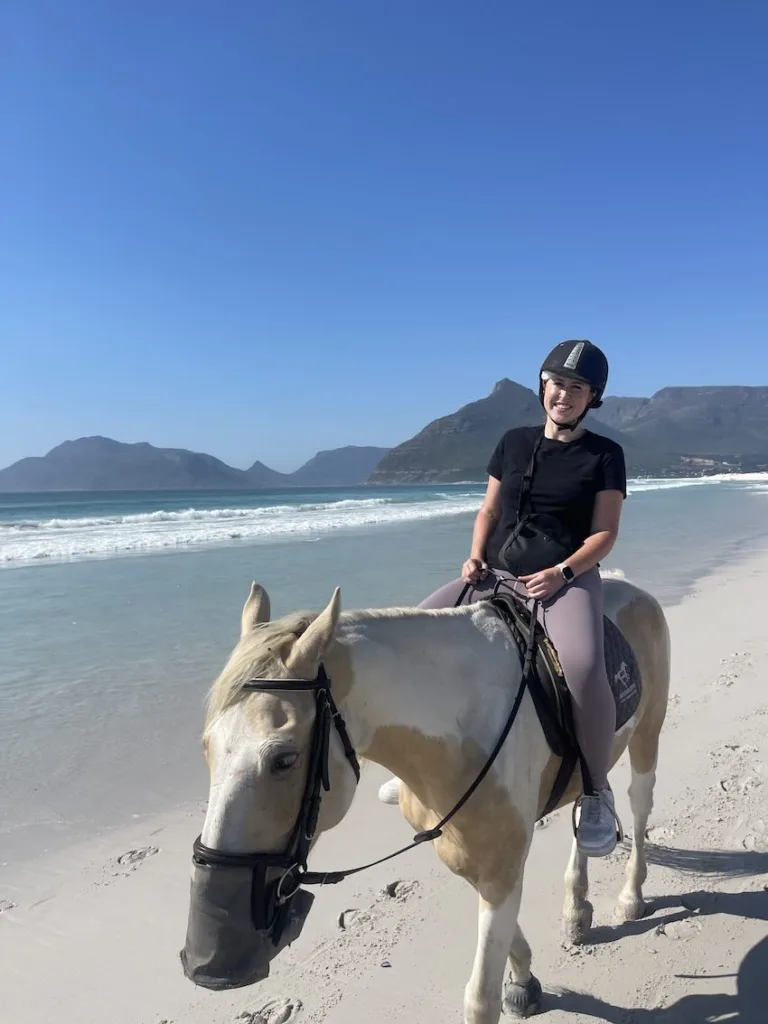 Hannah on a horse on Noordhoek beach