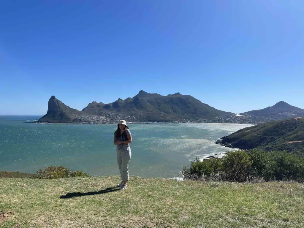 Hannah in front of Hout Bay on Victoria Road