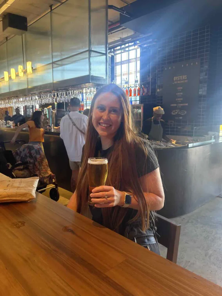 Hannah with a beer at Time Out Market
