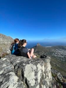 Hannah and Jess sitting on a rock during the India Venster hike