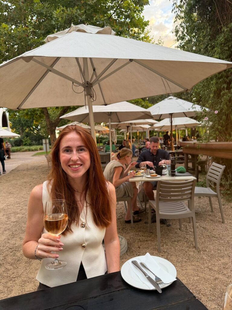 Hannah drinking rose at Eikendal