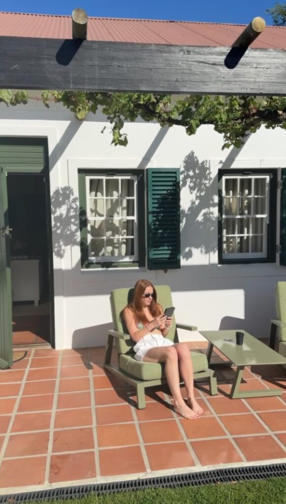 Hannah reading on the private terrace at Eikendal